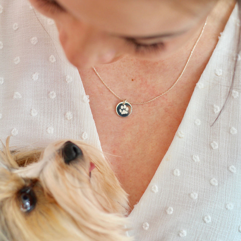 Woman is wearing a pet jewelry made in Canada.