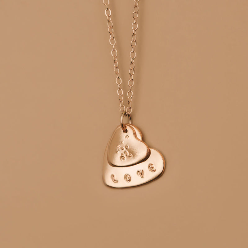 hand stamped zodiac double heart necklace