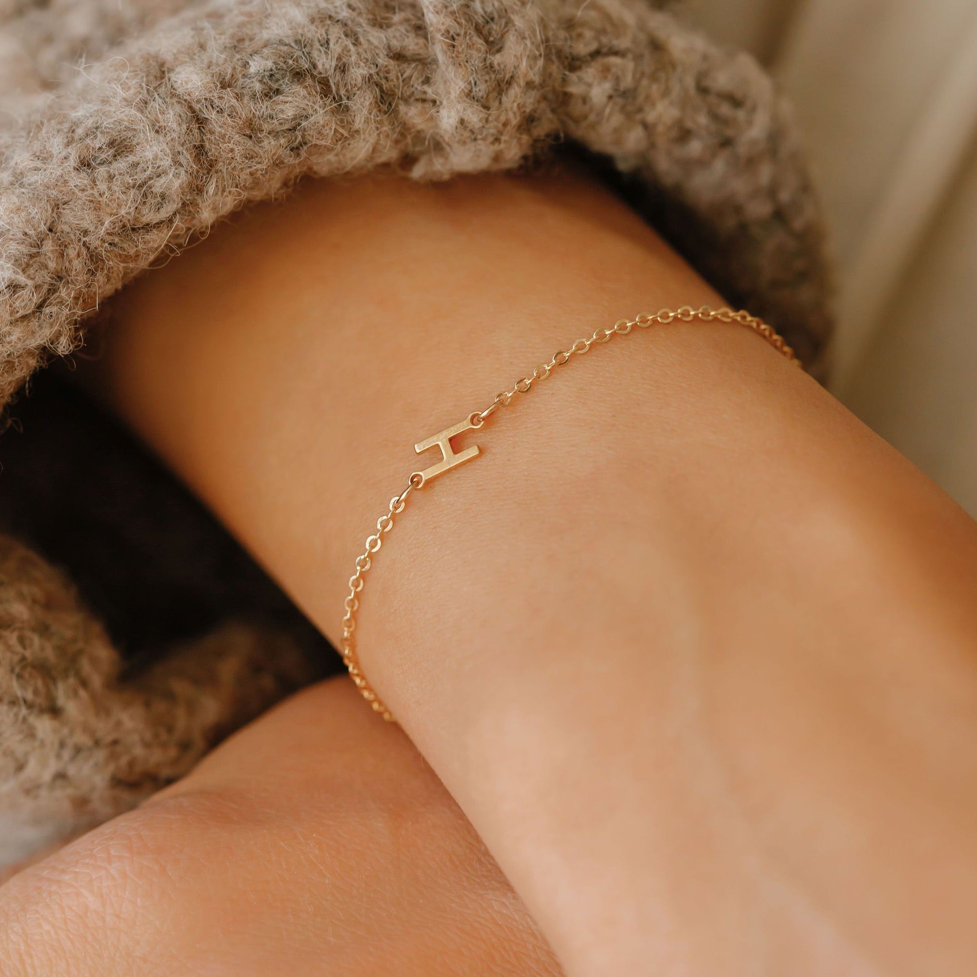 sideways letter bracelet with the letter H