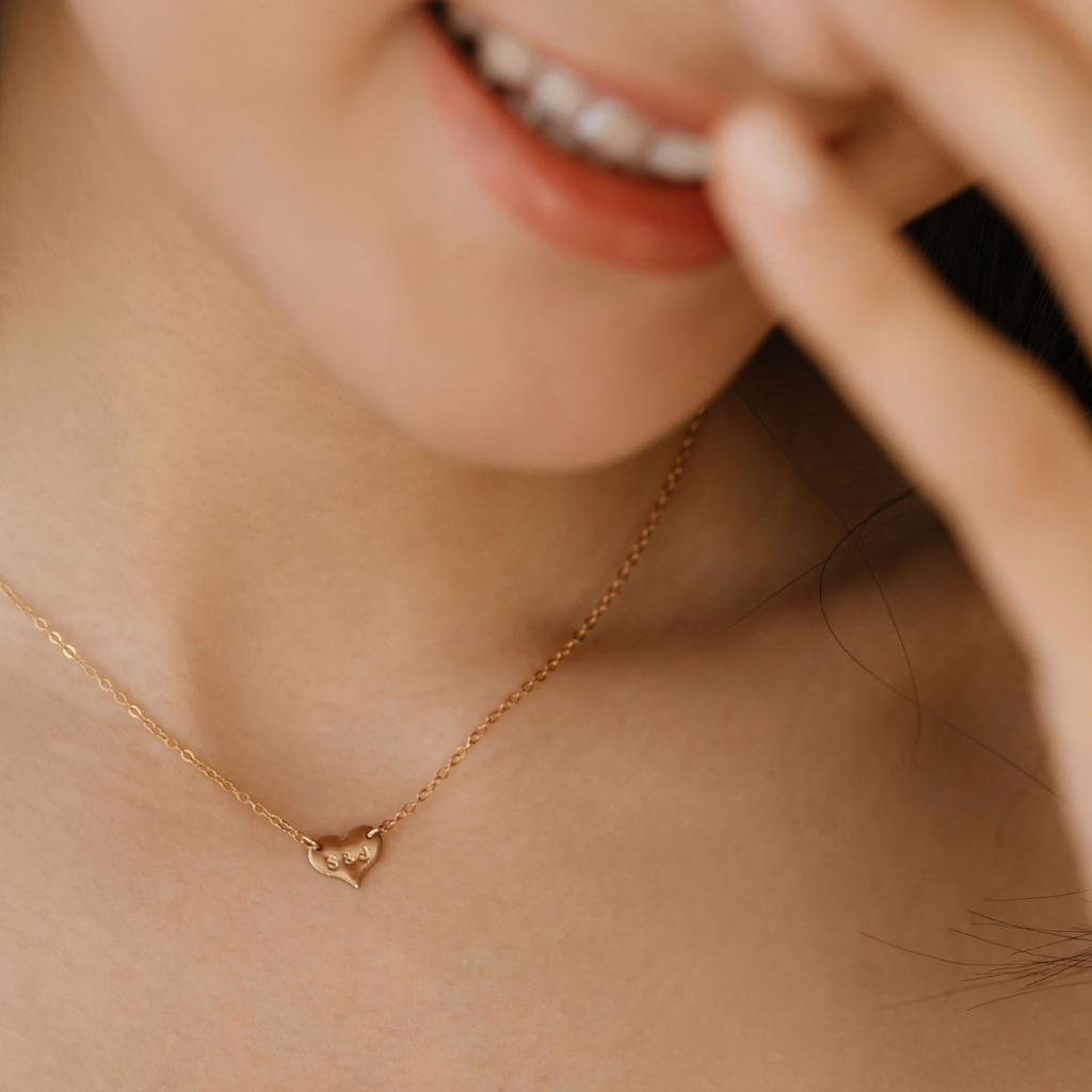 woman wearing hand stamped sweetheart necklace